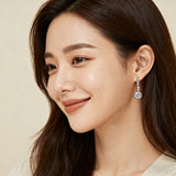 925 Sterling Silver Elegant Moissanite Drop Earrings With Symmetrical Design And Graduated Stones
