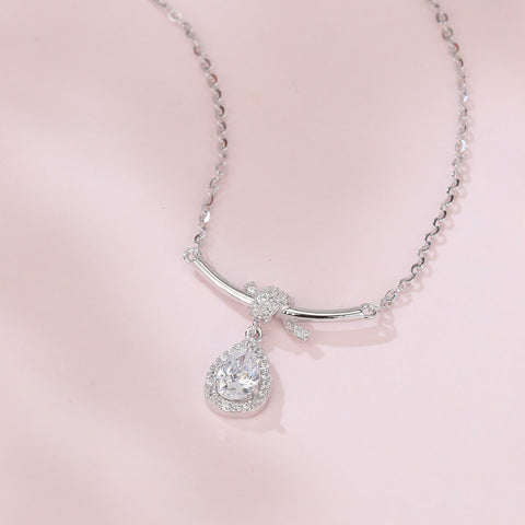 925 Sterling Silver Elegant Zircon Teardrop Necklace With Bow Accent In Sterling Silver